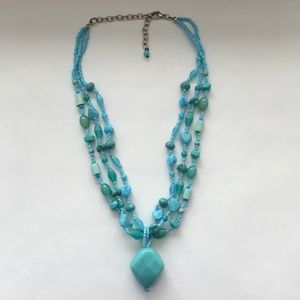 Triple strand bead necklace